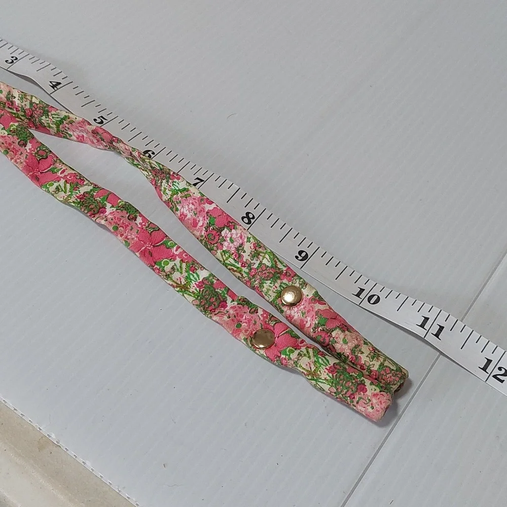 Lilly Pulitzer floral sunglass strap with pink and green colors.